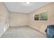 Unfinished basement with concrete walls and floors and a small window at 1630 Lakeview Ct, Eustis, FL 32726