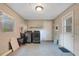 Basement area featuring washer, dryer, door and window for natural light at 1630 Lakeview Ct, Eustis, FL 32726