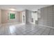 Open-concept living area with tile floors, offering access to the staircase and multiple rooms at 1630 Lakeview Ct, Eustis, FL 32726