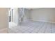 Open-concept living area with tile floors, offering access to the staircase and multiple rooms at 1630 Lakeview Ct, Eustis, FL 32726