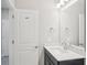 Bright bathroom featuring a white quartz countertop, modern vanity, and ample mirror at 16526 Silver Brook Way, Winter Garden, FL 34787