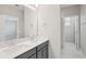 Bathroom featuring double vanity with quartz countertop and glass shower at 16526 Silver Brook Way, Winter Garden, FL 34787