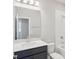 Bathroom featuring vanity with quartz countertop, mirror, and tub with shower at 16526 Silver Brook Way, Winter Garden, FL 34787