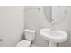 Stylish powder room featuring a pedestal sink and modern fixtures at 16526 Silver Brook Way, Winter Garden, FL 34787
