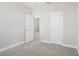 Well-lit bedroom with plush carpeting, light grey walls, and white trim throughout at 16526 Silver Brook Way, Winter Garden, FL 34787
