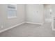 Neutral bedroom with large window and plush carpet flooring at 16526 Silver Brook Way, Winter Garden, FL 34787
