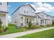 Attractive two-story home featuring a cozy porch and neatly manicured lawn at 16526 Silver Brook Way, Winter Garden, FL 34787