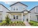 Charming two-story home featuring a welcoming front porch and neat landscaping at 16526 Silver Brook Way, Winter Garden, FL 34787