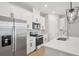 Bright kitchen features stainless appliances, white cabinets, and a center island at 16526 Silver Brook Way, Winter Garden, FL 34787