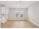 Bright living area with hardwood floors and a view of the landscaped exterior at 16526 Silver Brook Way, Winter Garden, FL 34787