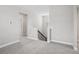 Neutral loft space with carpet flooring, stairwell access and natural lighting at 16526 Silver Brook Way, Winter Garden, FL 34787