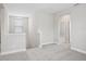 Neutral loft space with carpet flooring and natural lighting at 16526 Silver Brook Way, Winter Garden, FL 34787