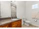 Bathroom featuring a vanity with a granite countertop and a separate shower at 18920 Overton St, Orlando, FL 32833