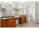 Bathroom features a double sink vanity with granite countertops, a soaking tub, and lots of light at 18920 Overton St, Orlando, FL 32833