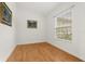 Bright bedroom with hardwood floors and a large window offering lots of natural light at 18920 Overton St, Orlando, FL 32833
