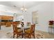 Dining area with a view of the kitchen and a table that seats four at 18920 Overton St, Orlando, FL 32833
