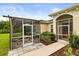 Cozy screened-in porch and patio area is an inviting outdoor space for gatherings at 18920 Overton St, Orlando, FL 32833