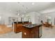 Open concept kitchen with stainless appliances, granite counters and view of living room and dining area at 18920 Overton St, Orlando, FL 32833