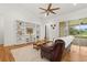 Bright living room with custom built-ins and a sliding glass door that leads to the lanai at 18920 Overton St, Orlando, FL 32833