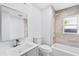 Bathroom featuring tiled shower and tub, sleek vanity, and modern fixtures at 1921 Dartmouth Ave, Winter Park, FL 32789