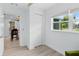 A bright bedroom with a closet and a view to an adjacent room at 1921 Dartmouth Ave, Winter Park, FL 32789