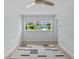 Bright bedroom featuring a window, clean white walls, and light hardwood flooring at 1921 Dartmouth Ave, Winter Park, FL 32789