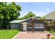 Charming home featuring a gray exterior, brick walkway, and pergola at 1921 Dartmouth Ave, Winter Park, FL 32789