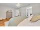 Bedroom features hardwood floors, light gray walls, dresser and view into hall, bathroom, and closet at 1930 Aster Dr, Winter Park, FL 32792