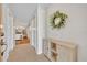 Light and airy hallway with decorative wreath and console table at 1930 Aster Dr, Winter Park, FL 32792