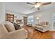 Cozy living room with a decorative fireplace, built-in bookshelves, and plush seating at 1930 Aster Dr, Winter Park, FL 32792