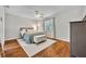 Tranquil bedroom with plush bed, accent rug, and ample natural light at 1930 Aster Dr, Winter Park, FL 32792