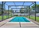 Screened in pool with crystal-clear water, and beautiful landscaping providing privacy for the backyard oasis at 1930 Aster Dr, Winter Park, FL 32792