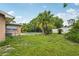 Home exterior highlighting the expansive yard and the pool at 2020 Cocos Ct, Winter Park, FL 32792