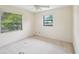 Empty bedroom featuring two windows allowing natural light at 2020 Cocos Ct, Winter Park, FL 32792