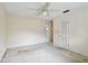 Spacious bedroom featuring ceiling fan, neutral walls, and carpeted flooring at 2020 Cocos Ct, Winter Park, FL 32792