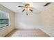 Cozy dining area featuring tiled floors, wallpaper, and a ceiling fan at 2020 Cocos Ct, Winter Park, FL 32792