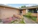 Front exterior features a small brick patio area and a walkway leading to the front door at 2020 Cocos Ct, Winter Park, FL 32792