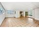Large living area with tile flooring, sliding glass doors, and ample natural light at 2020 Cocos Ct, Winter Park, FL 32792
