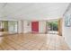 Spacious sunroom with tile flooring, sliding glass doors, and ample natural light at 2020 Cocos Ct, Winter Park, FL 32792