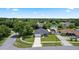 Aerial view of home featuring well-maintained lawn and mature trees in established neighborhood at 2305 Ascot Ave, Orlando, FL 32833