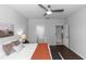 Bright bedroom featuring hardwood floors and access to the bathroom and other areas at 2305 Ascot Ave, Orlando, FL 32833