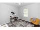Bedroom featuring a desk area and a cozy yellow chair adding a functional and stylish space at 2305 Ascot Ave, Orlando, FL 32833
