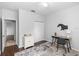Bedroom with a desk, closet, and decor, offering a functional and organized space at 2305 Ascot Ave, Orlando, FL 32833