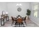 Modern dining room with stylish chandelier, wood-look flooring, and decorative accents at 2305 Ascot Ave, Orlando, FL 32833