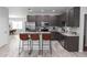 Modern kitchen with stainless steel appliances, granite countertops, and a breakfast bar at 2305 Ascot Ave, Orlando, FL 32833