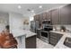 Stylish kitchen featuring stainless steel appliances, granite countertops, and ample cabinet space at 2305 Ascot Ave, Orlando, FL 32833