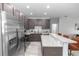 Beautiful kitchen with stainless steel appliances, granite countertops, and ample cabinet space at 2305 Ascot Ave, Orlando, FL 32833