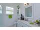 Fresh bathroom with modern vanity, white cabinetry, granite countertop, and a bright, airy atmosphere at 2440 Pawtucket Pass, Mount Dora, FL 32757