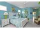 Comfortable bedroom featuring calming blue walls, white furniture, and unique decorative touches at 2440 Pawtucket Pass, Mount Dora, FL 32757