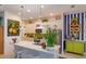 Bright kitchen with white cabinets, modern appliances, and a large island at 2440 Pawtucket Pass, Mount Dora, FL 32757